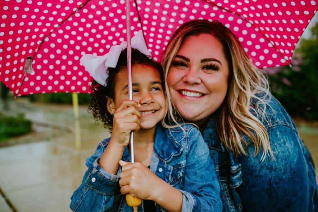 girl and woman under umbrella