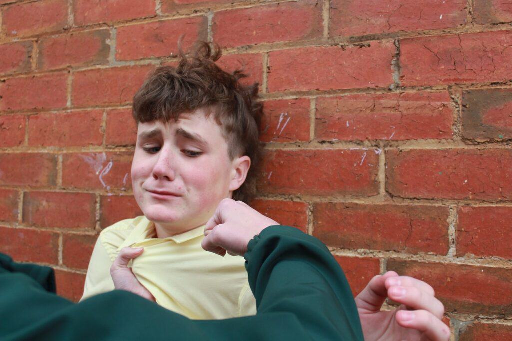 Scared teen being bullied