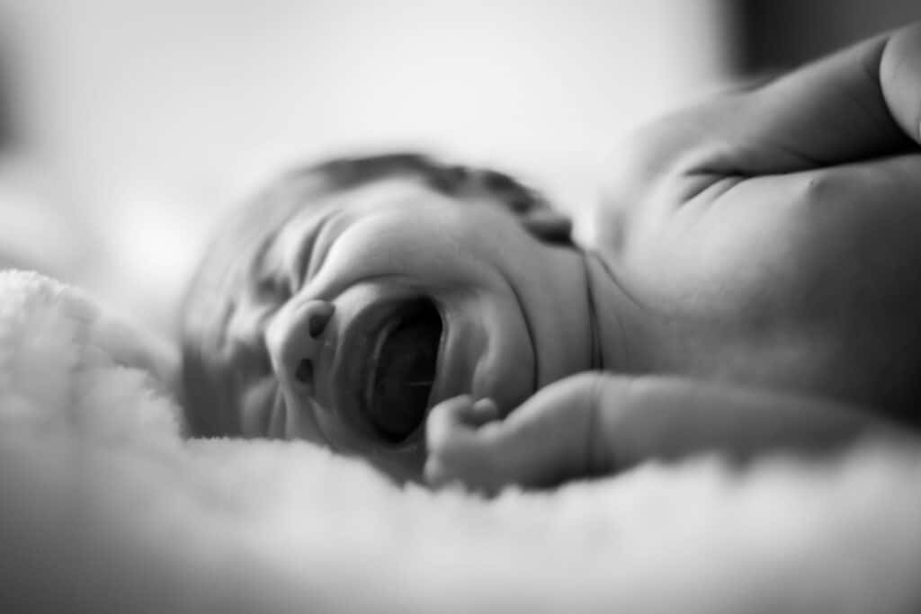 baby crying in bed