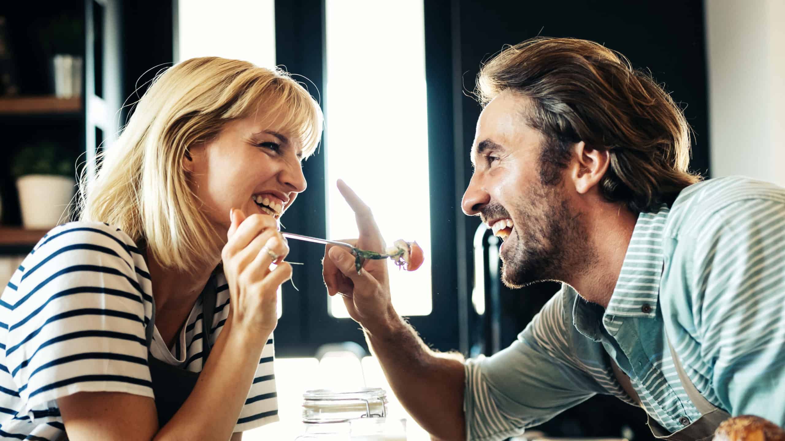 a man and a woman share dinner