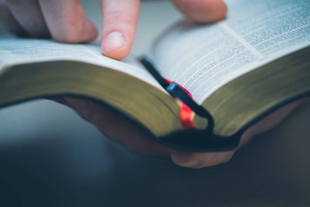 a man with a bible open