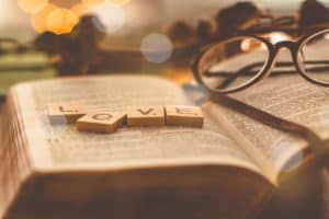 Picture of Bible with the word Love on it showing how Bible verses for Valentine's Day can be found in the Bible