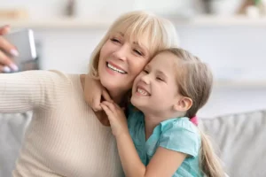 Grandmother taking a photo with her grandchild