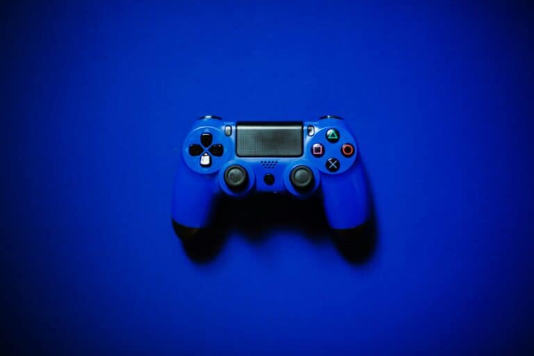 This image shows a blue controller in front of a blue background, set to describe the idea of video games. What does the bible say about video games?